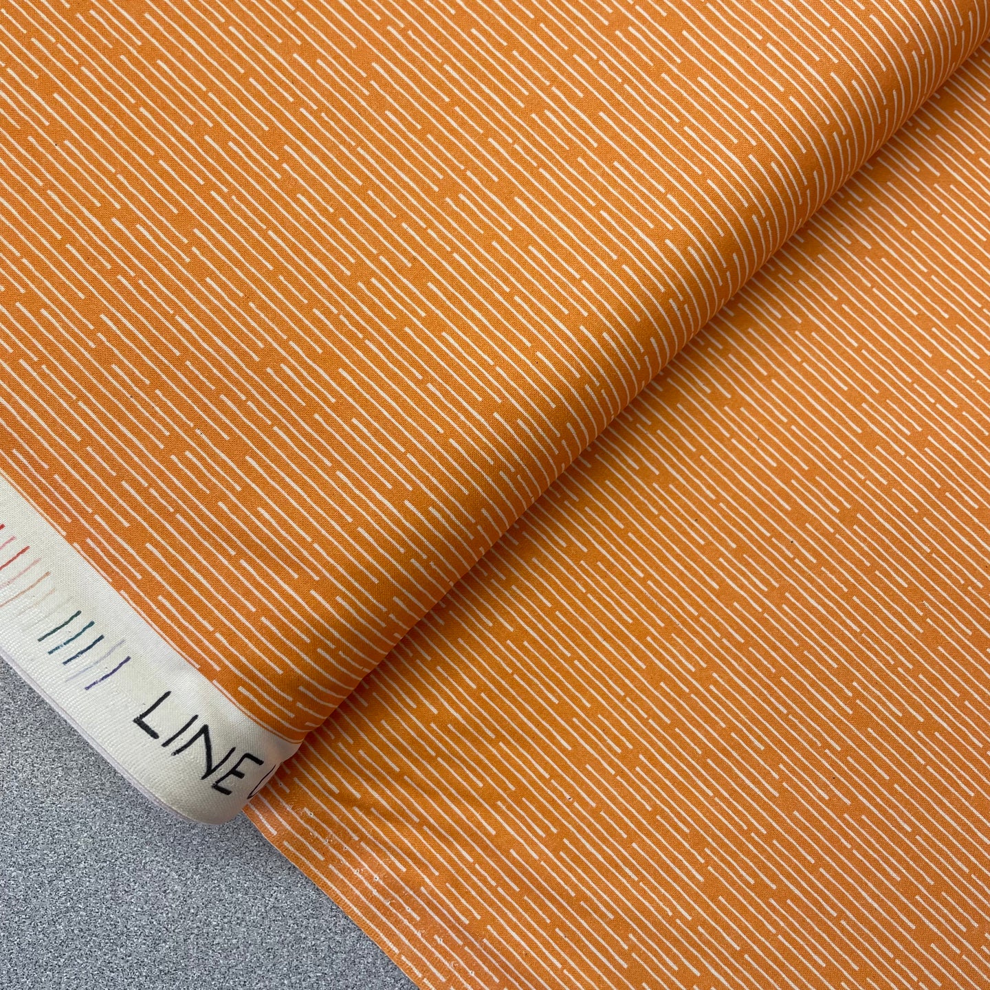 Line Up, White on Orange, 38023374 for Paintbrush Studio, sold by the half-yard