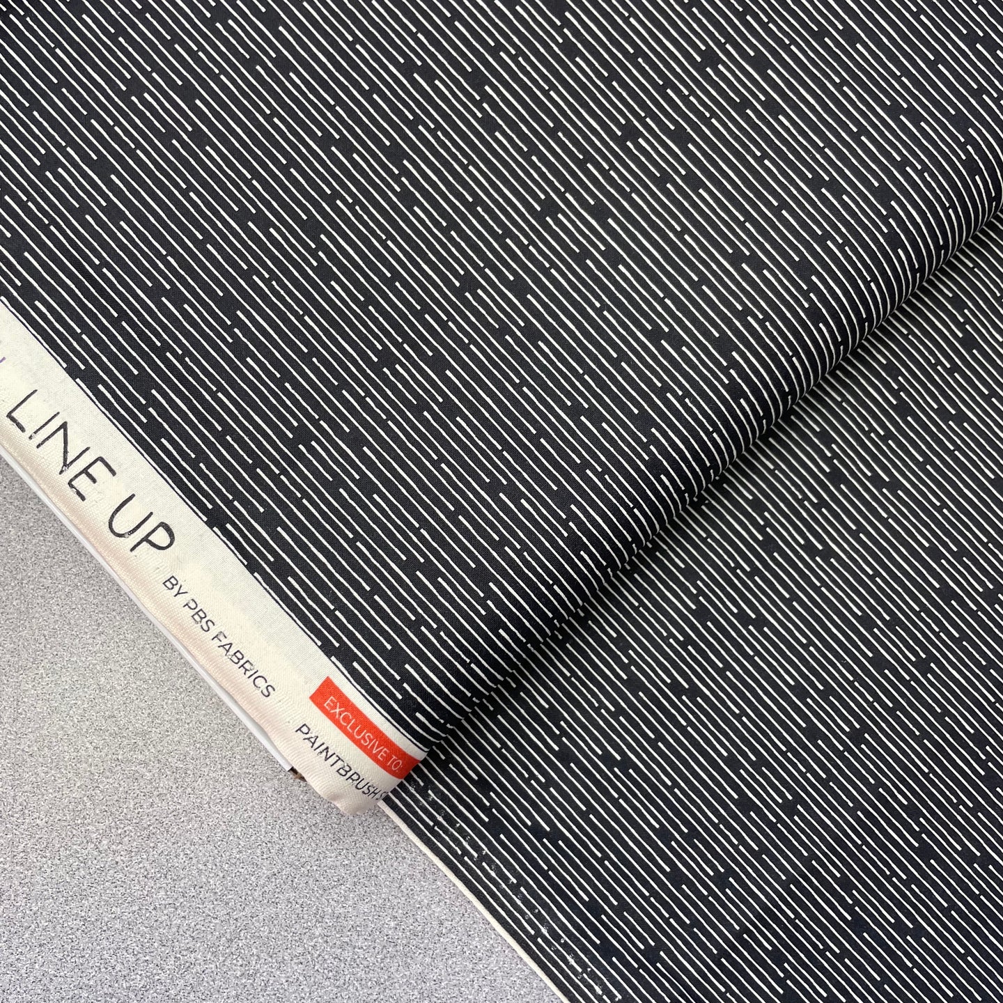 Line Up, White on Black, 38023356 for Paintbrush Studio, sold by the half-yard