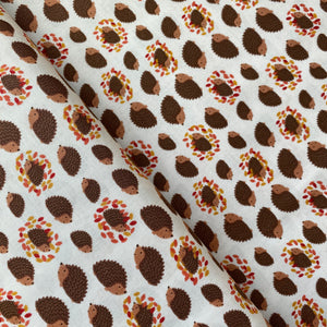 Hedgehogs & Leaves on Cream by Lewis & Irene, sold by the half-yard