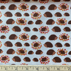 Hedgehogs & Leaves on Cream by Lewis & Irene, sold by the half-yard