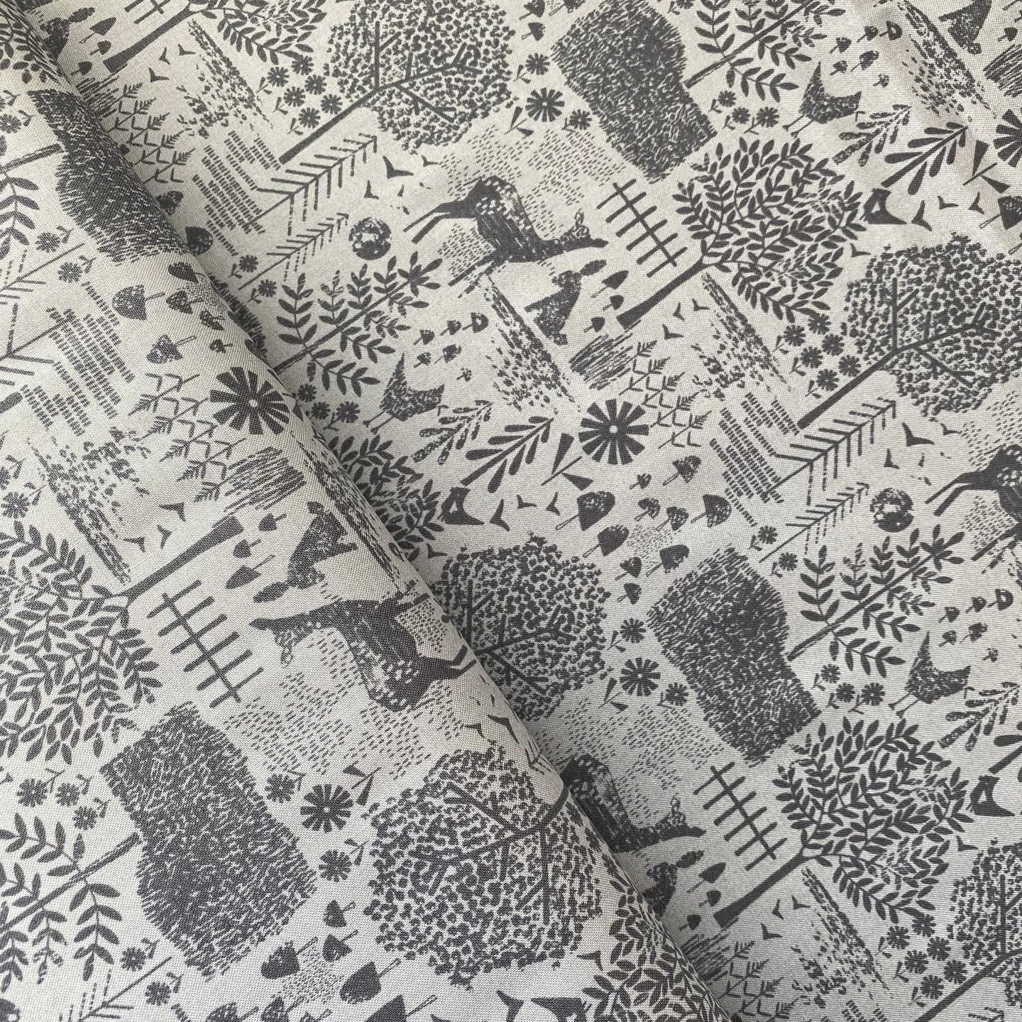 Flora and Fauna on Slate by Dear Stella, sold by the half-yard