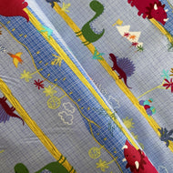 Dinosaur Park on Blue by Michael Miller Fabrics, sold by the half-yard