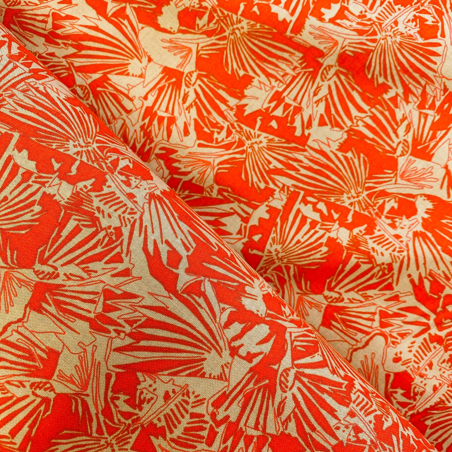 Gleaned in Tangerine by Carolyn Friedlander for Robert Kaufman, sold by the half-yard