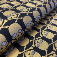 Gothic Glam Metallic Gold Skulls on Black, by Kanvas Studio, sold by the half-yard
