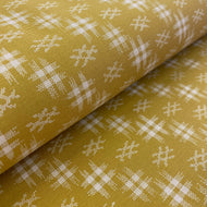 White on Dark Golden Textured Print by Westrade, sold by the half-yard