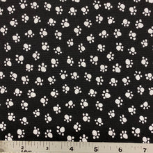 Load image into Gallery viewer, Paw Prints on Black by Michael Miller Fabrics, sold by the half-yard

