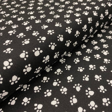 Load image into Gallery viewer, Paw Prints on Black by Michael Miller Fabrics, sold by the half-yard
