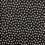Paw Prints on Black by Michael Miller Fabrics, sold by the half-yard