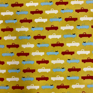 Pooches and Pick Ups on Yellow for Robert Kaufman, sold by the half-yard