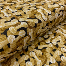 Load image into Gallery viewer, Rawhide Dog Bones on Black by Paintbrush Studios, sold by the half-yard
