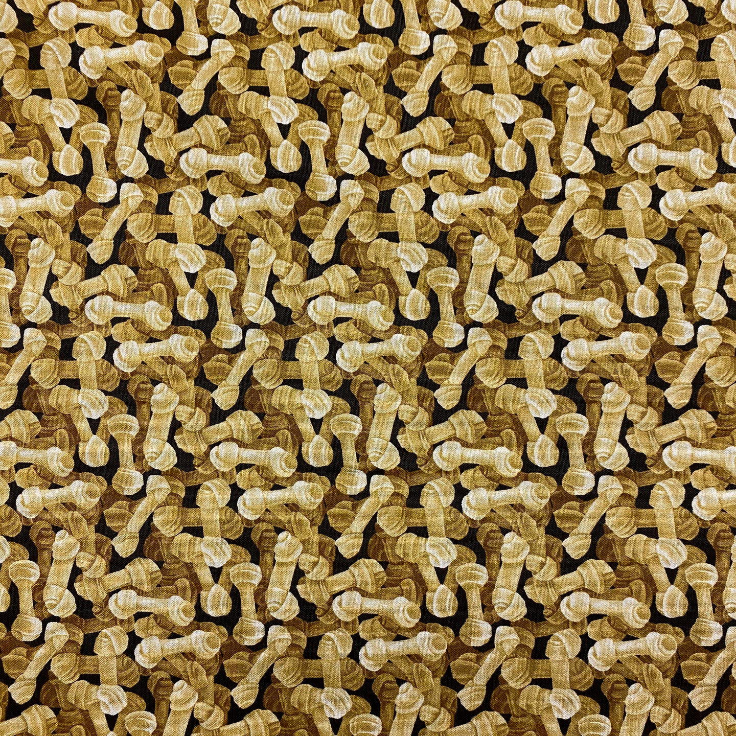 Rawhide Dog Bones on Black by Paintbrush Studios, sold by the half-yard