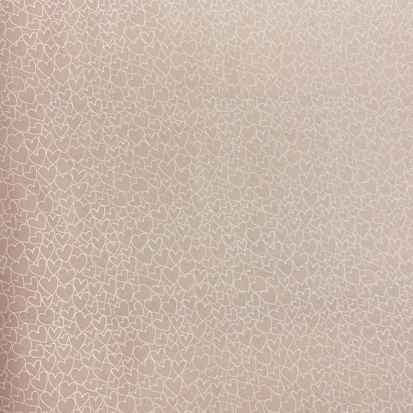 Peachy Stencil Hearts by Makower UK, sold by the half-yard