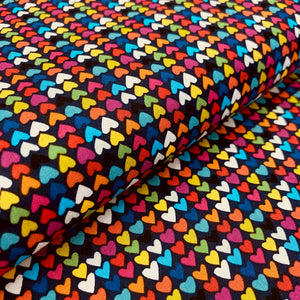 Happy Hearts in Multi on Navy Blue,  by Clothworks, sold by the half-yard